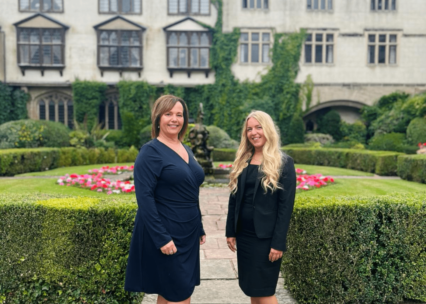 our Wedding Manager, Jo, and Coordinator, Hannah with Coombe Abbey Hotel in the background